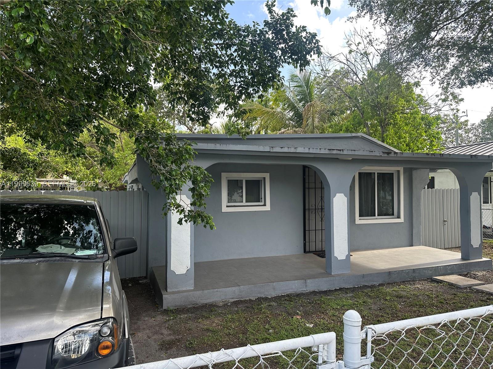 1790 Northwest 112th Street Miami, FL 33167 - Photo 3 of 6 a front view of a house with garden