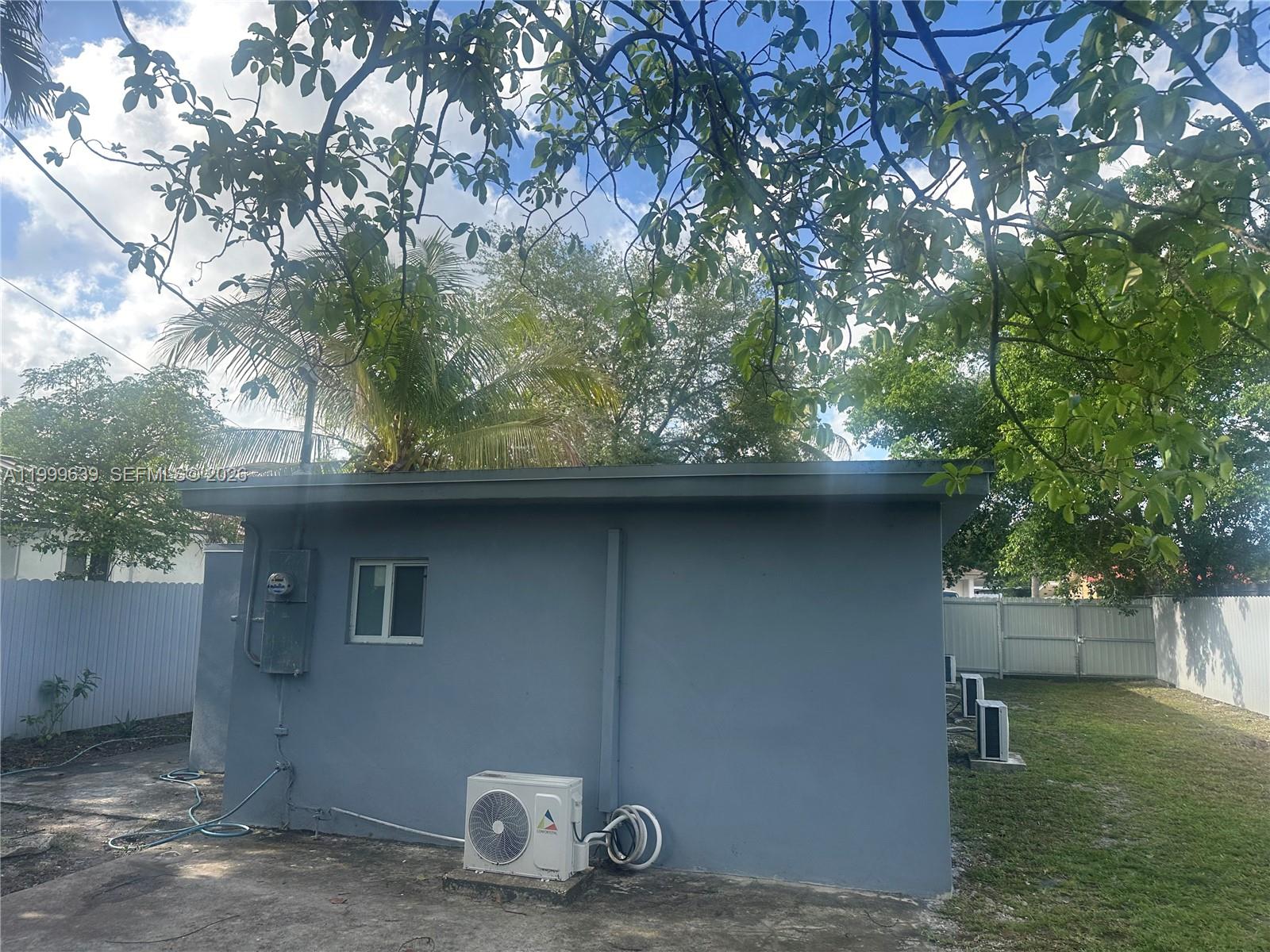 1790 Northwest 112th Street Miami, FL 33167 - Photo 4 of 6 a front view of a house with garden