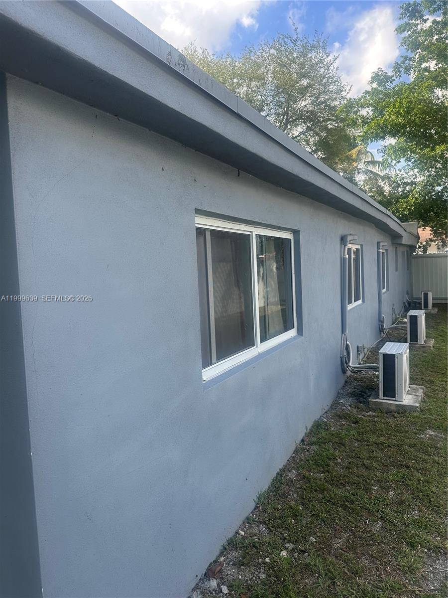 1790 Northwest 112th Street Miami, FL 33167 - Photo 5 of 6 a house view with a backyard space