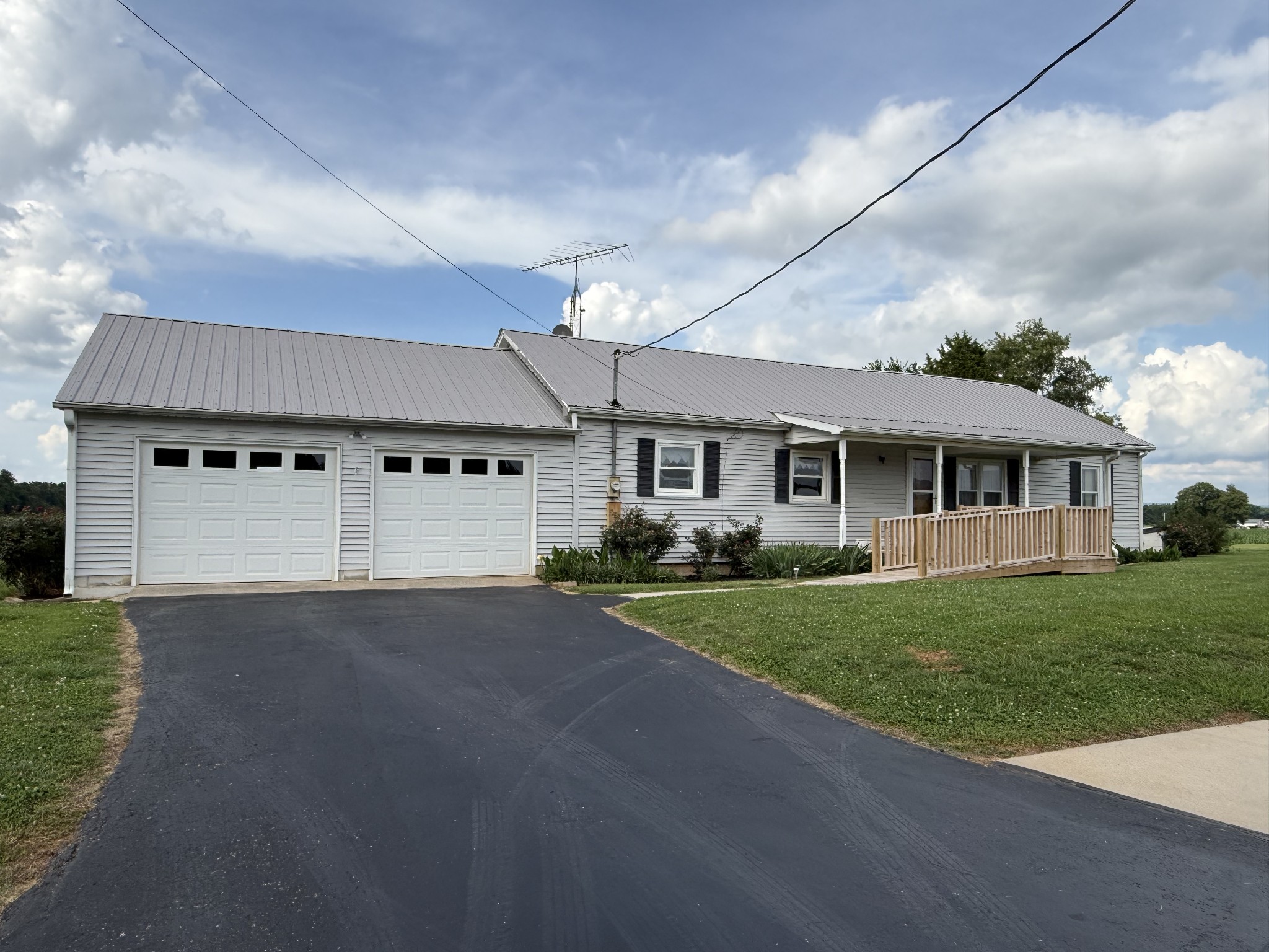 2971 Monroe Floyd Road Decherd, TN 37324 - Photo 2 of 26 a front view of a house with a yard and garage