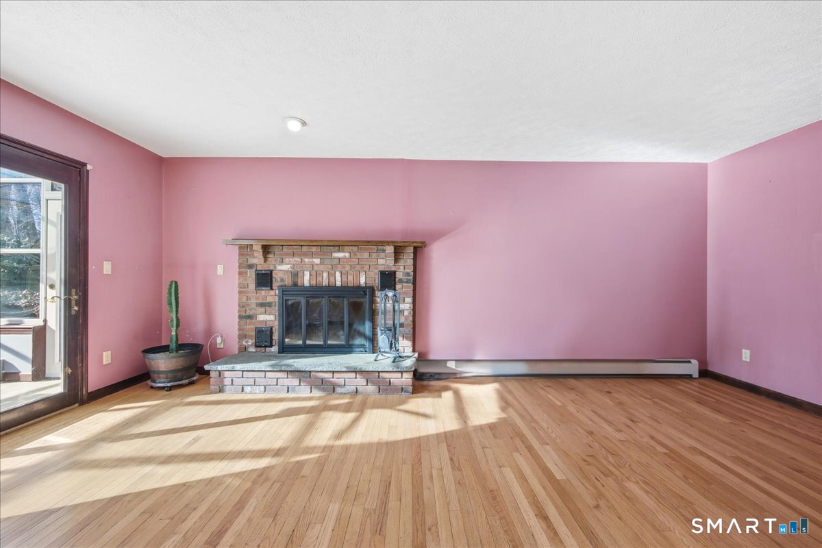 17 Inchcliffe Drive Ledyard, CT 06335 - Photo 13 of 40 a view of a room with wooden floor and windows