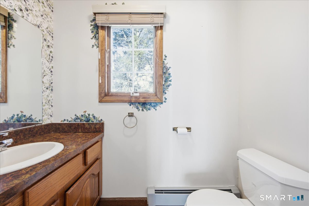 17 Inchcliffe Drive Ledyard, CT 06335 - Photo 17 of 40 a bathroom with a sink and toilet