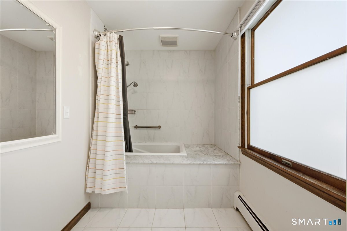 17 Inchcliffe Drive Ledyard, CT 06335 - Photo 22 of 40 a bathroom with a bathtub and a shower