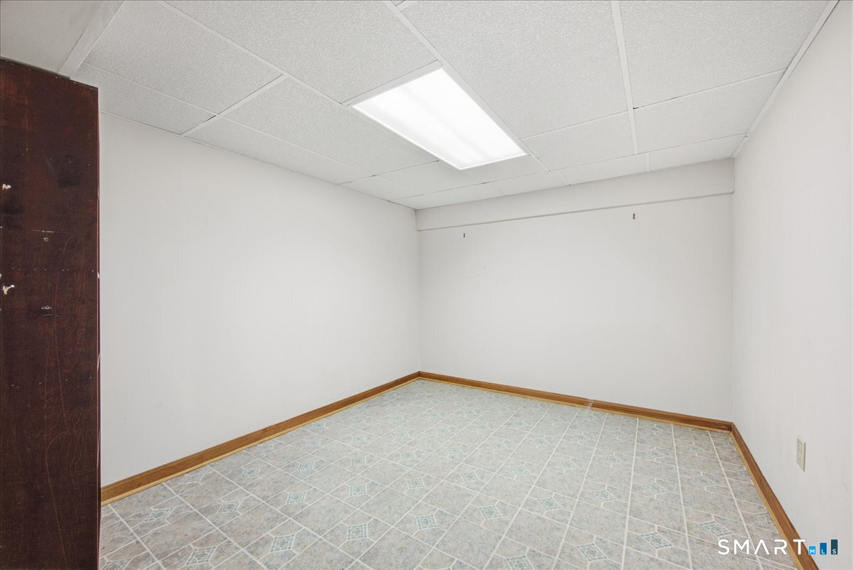 17 Inchcliffe Drive Ledyard, CT 06335 - Photo 28 of 40 an empty room with a empty space and window