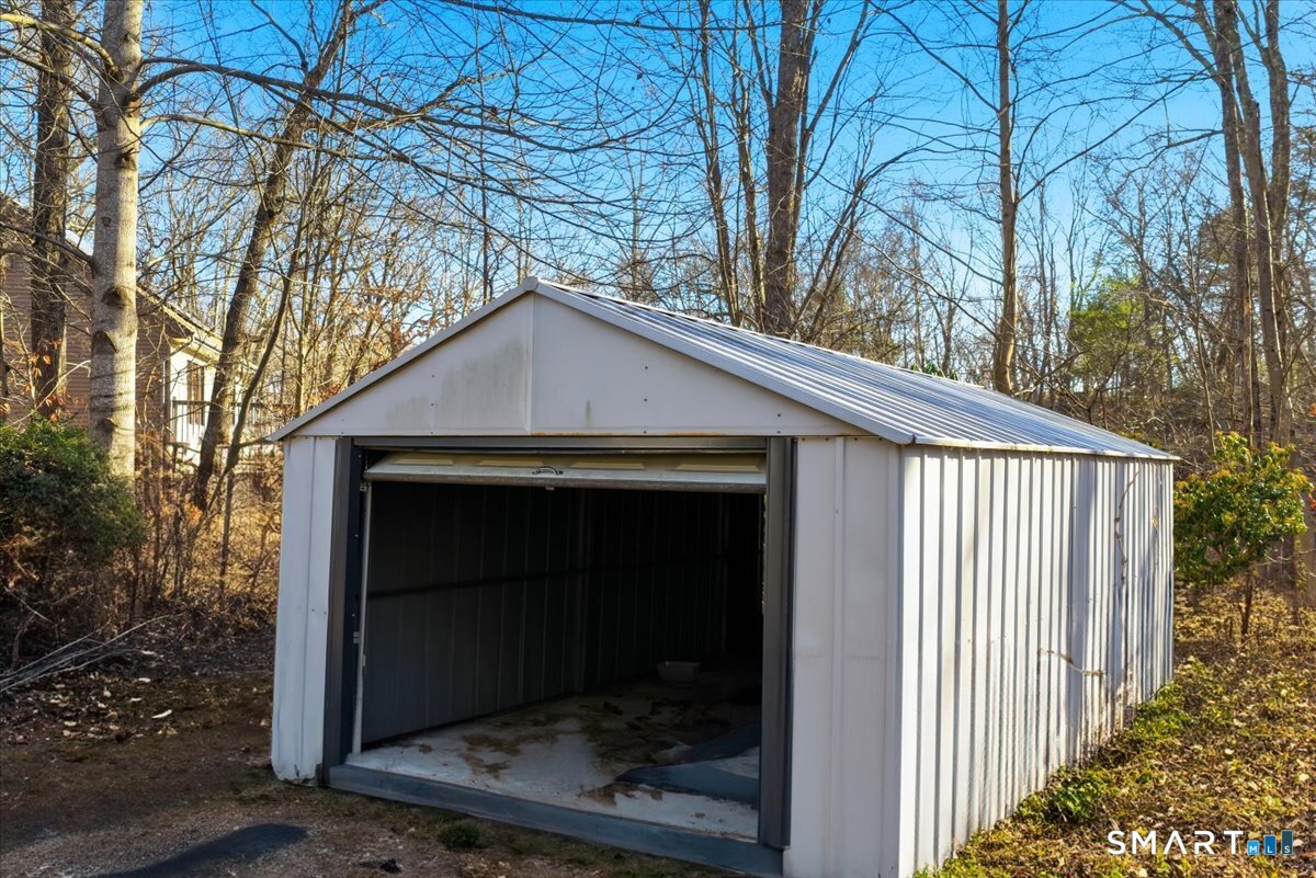 17 Inchcliffe Drive Ledyard, CT 06335 - Photo 35 of 40 a house with trees in front of it