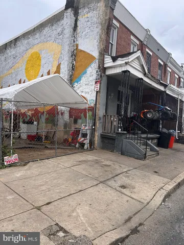 a view of a building with sitting area