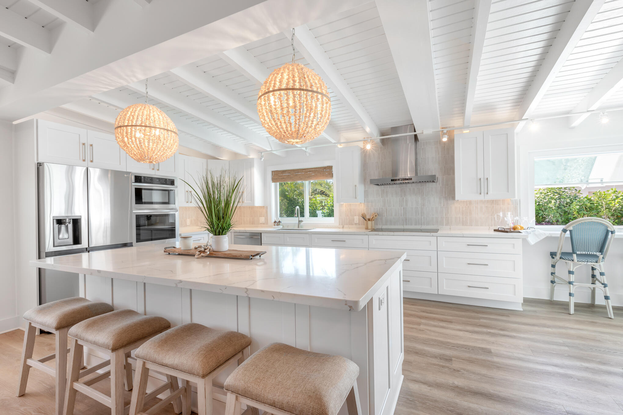 1701 Atlantic Boulevard Key West, FL 33040 - Photo 14 of 39 a kitchen with cabinets and chairs
