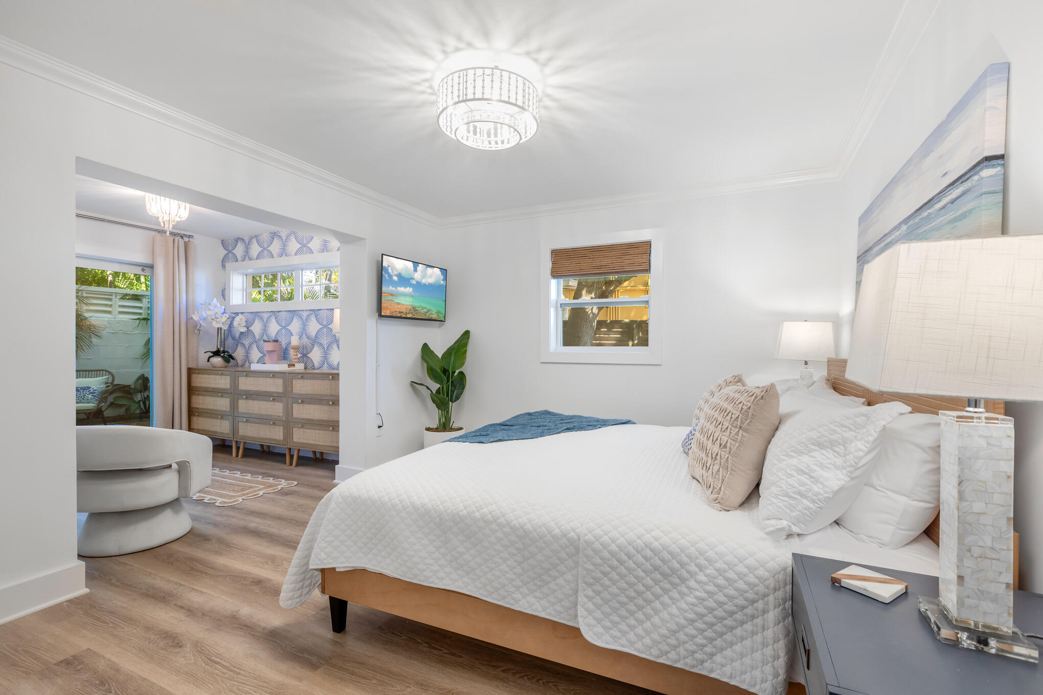 1701 Atlantic Boulevard Key West, FL 33040 - Photo 18 of 39 a bedroom with a bed and a chandelier