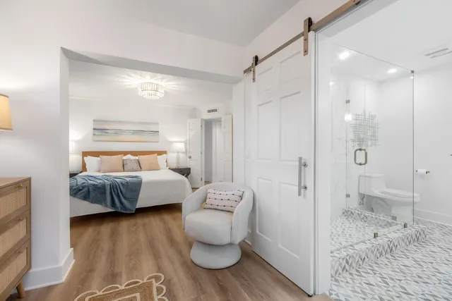 a spacious bedroom with a bed and a couch