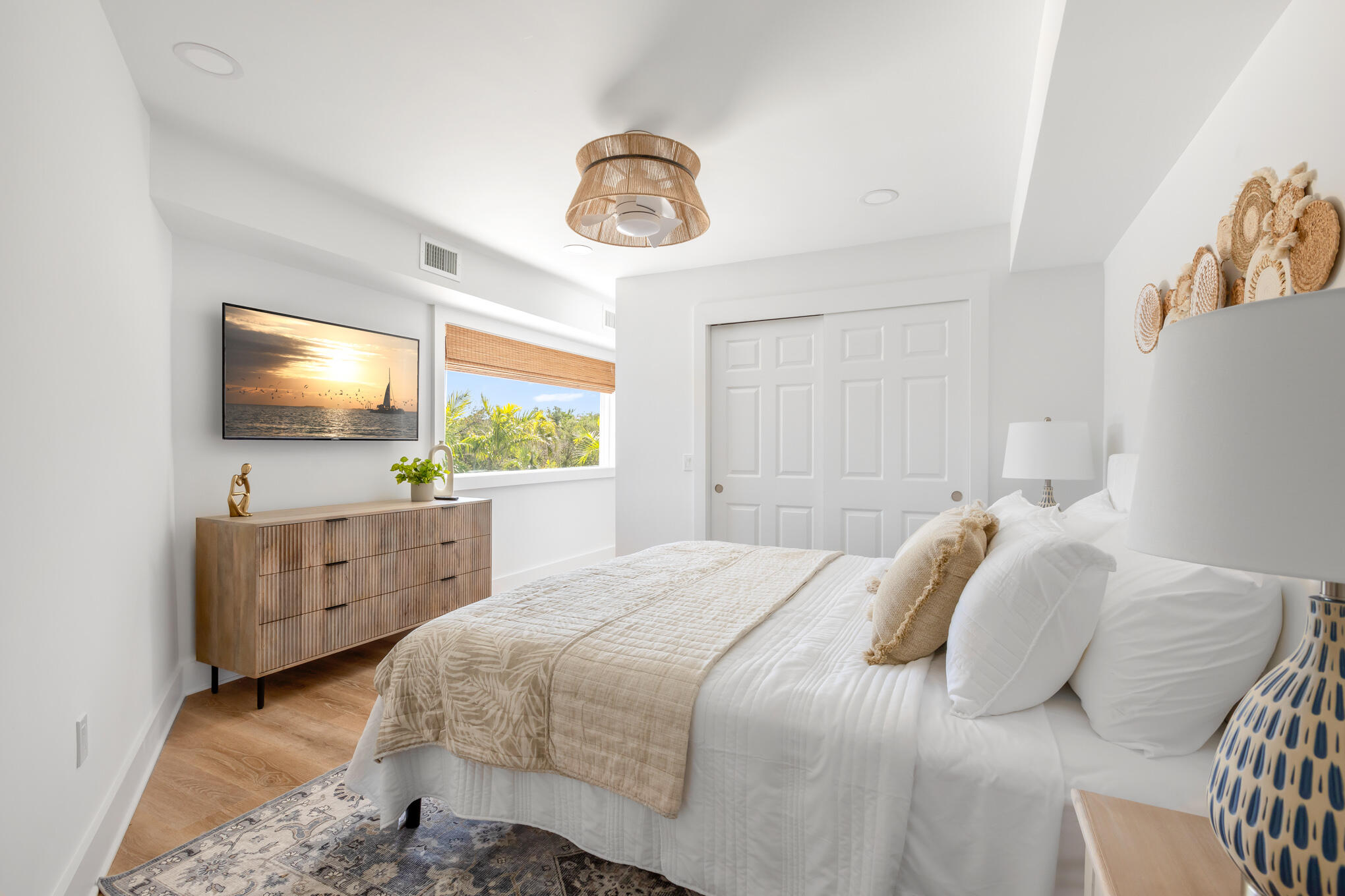 1701 Atlantic Boulevard Key West, FL 33040 - Photo 27 of 39 a bedroom with a bed and a flat screen tv