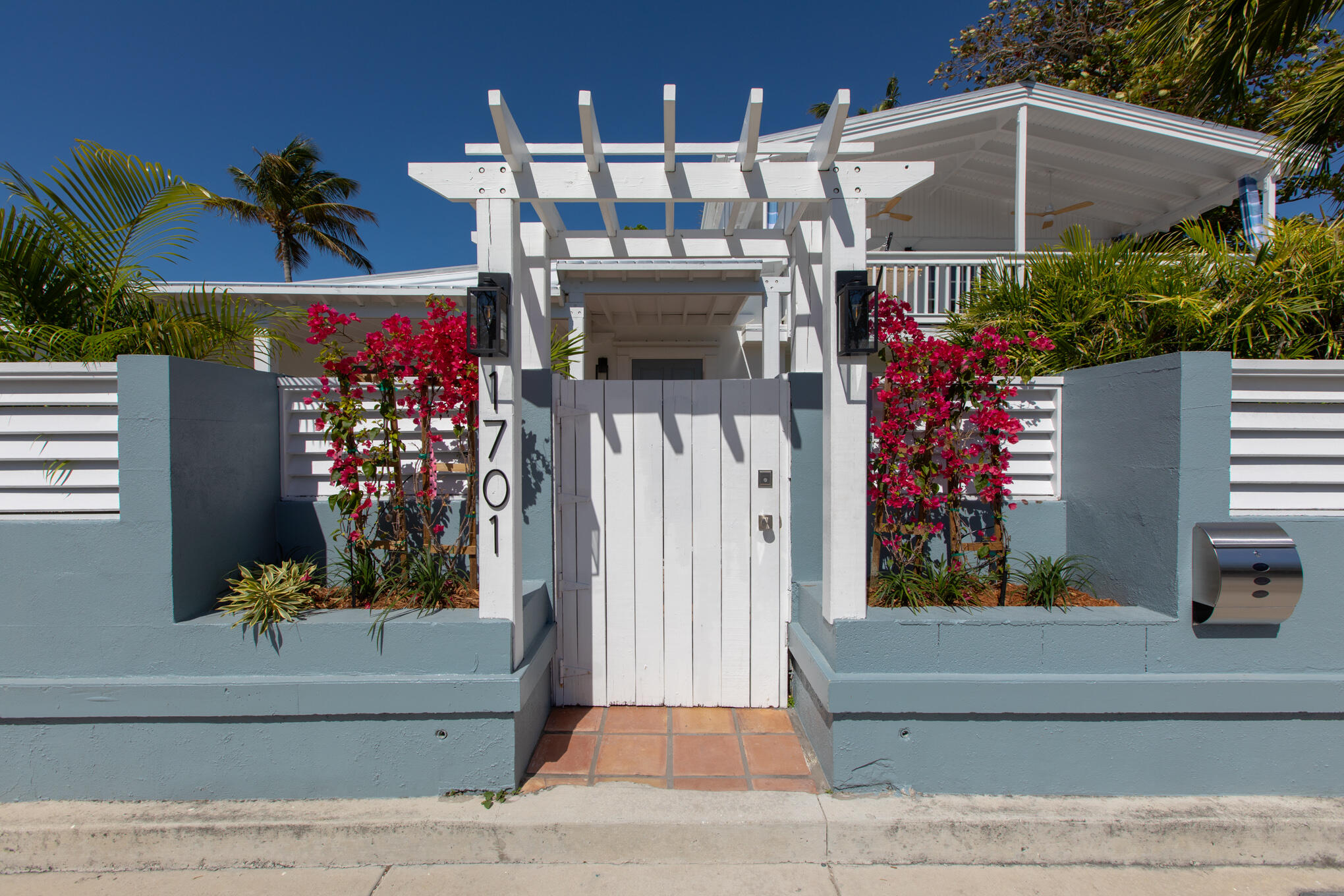 1701 Atlantic Boulevard Key West, FL 33040 - Photo 3 of 39 a view of a house with potted plants and a fountain