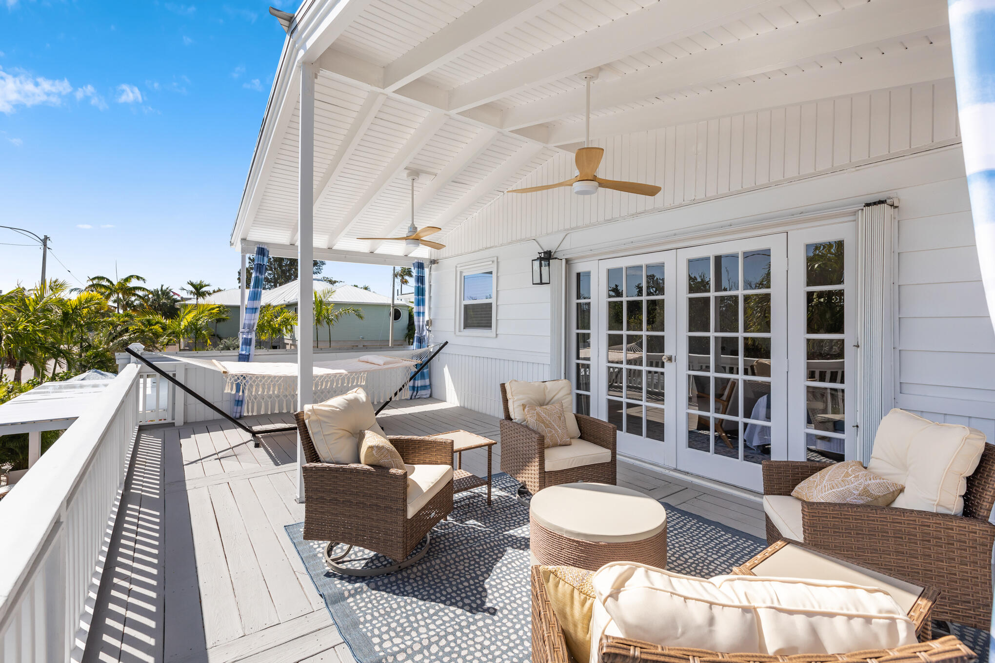 1701 Atlantic Boulevard Key West, FL 33040 - Photo 34 of 39 a balcony with furniture and a potted plant