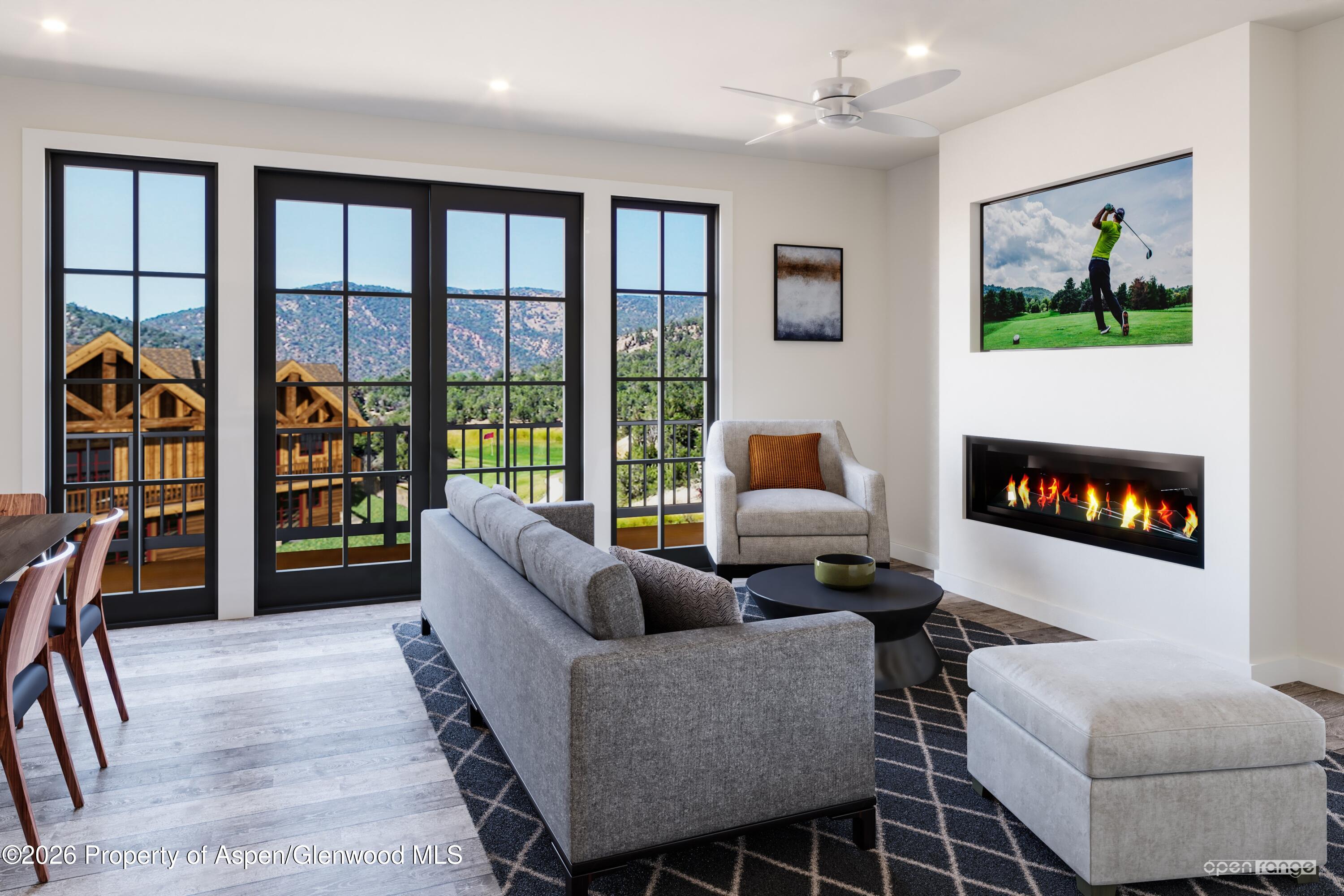 303 Thunderbird New Castle, CO 81647 - Photo 4 of 13 a living room with furniture a flat screen tv and a floor to ceiling window