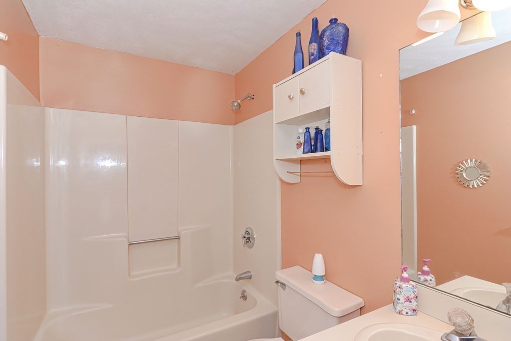 44 Cranberry Road Bourne, MA 02532 - Photo 16 of 33 a bathroom with a bathtub and a shower