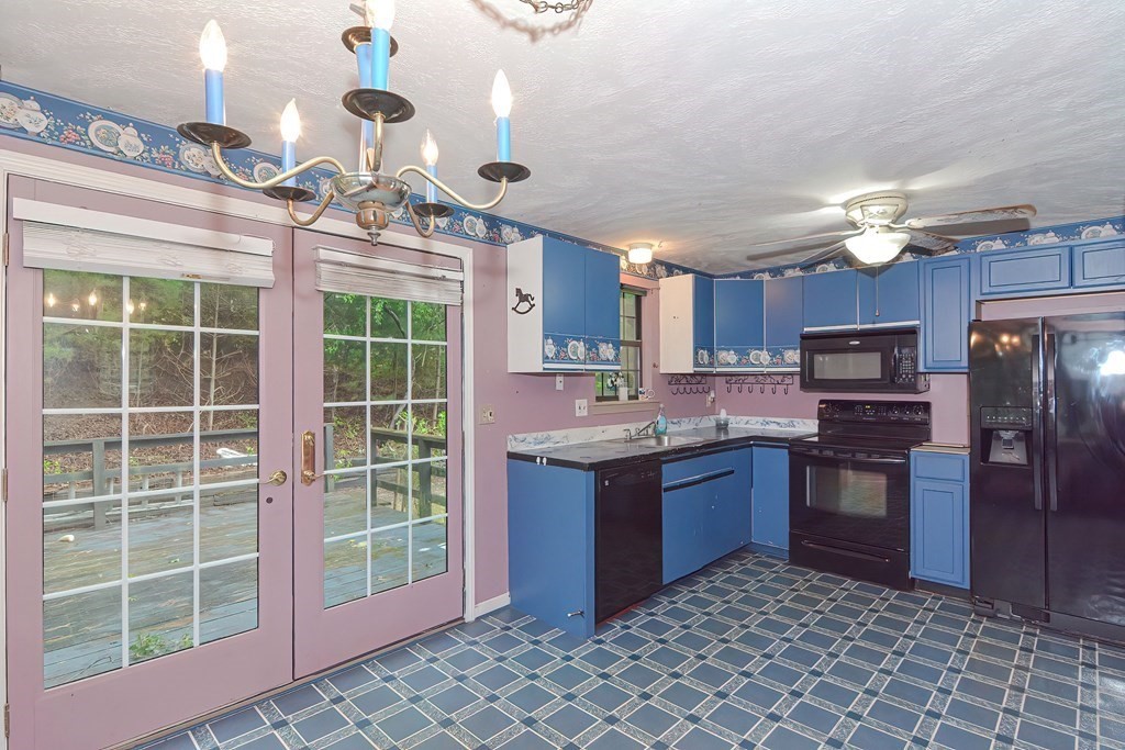 44 Cranberry Road Bourne, MA 02532 - Photo 8 of 33 a kitchen with stainless steel appliances granite countertop a stove and a refrigerator