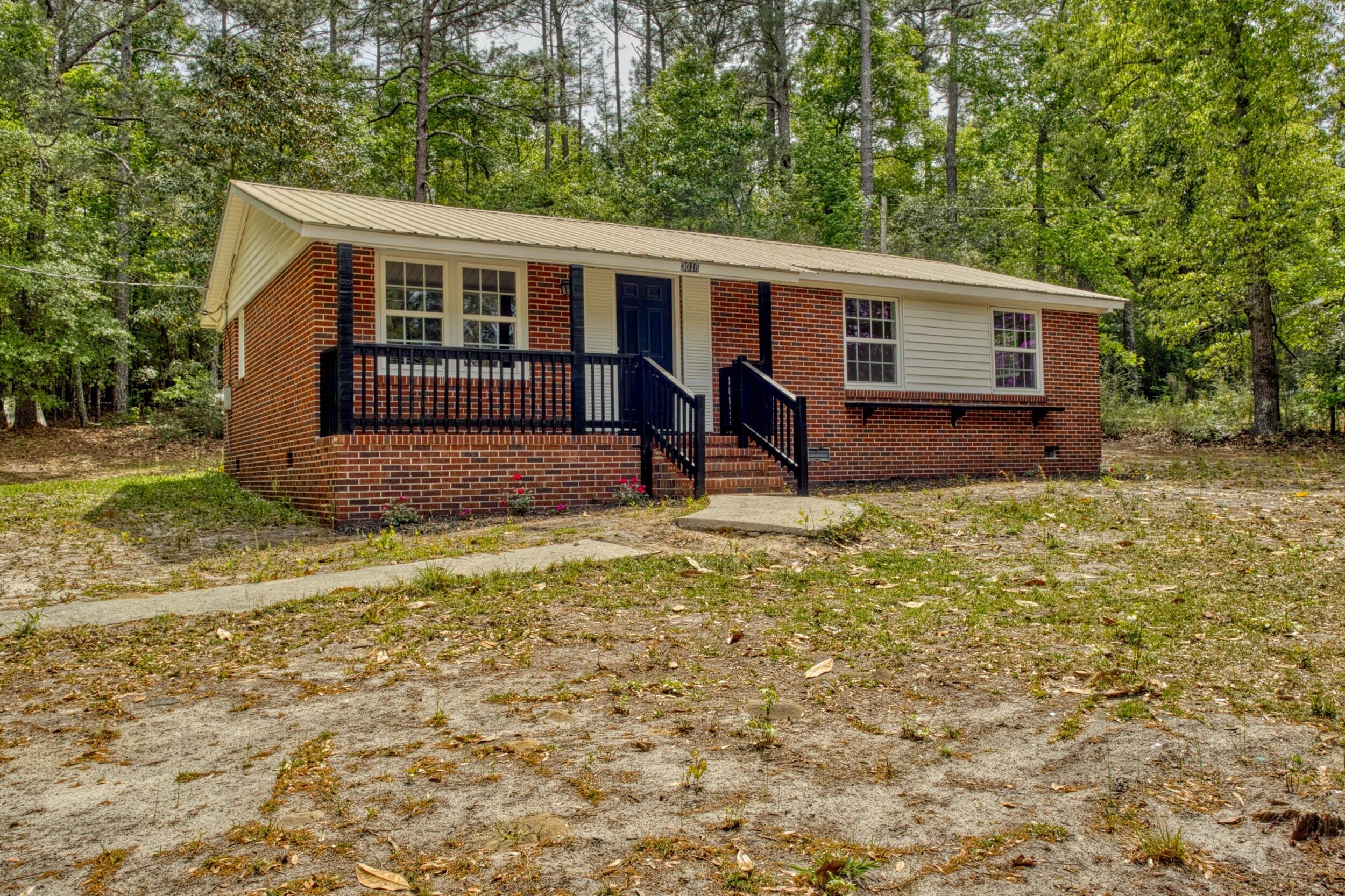 3016 Wagener Road Aiken, SC 29801 - Photo 2 of 29 a view of a house with backyard and a tree