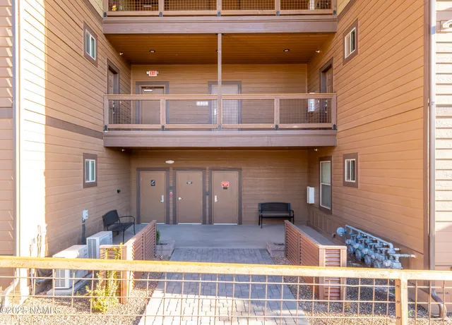 a view of brick building with large windows