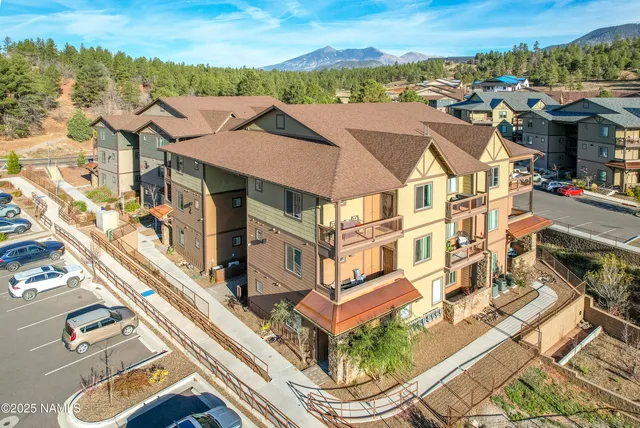 a view of a white house with a ocean view