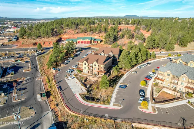 an aerial view of a house with a ocean view