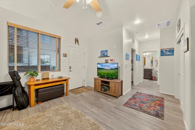 a living room with furniture and a couch