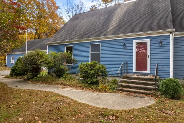 a view of house with back yard