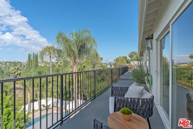 a view of a balcony with chair