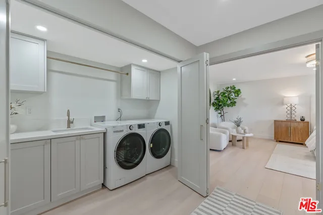 a bedroom with bed and a potted plant