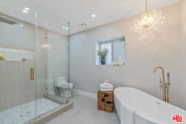 a bathroom with a shower and a toilet