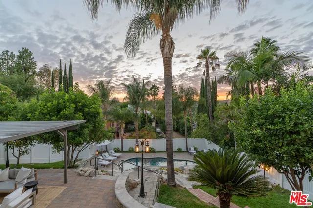 a outdoor living space with furniture and garden view