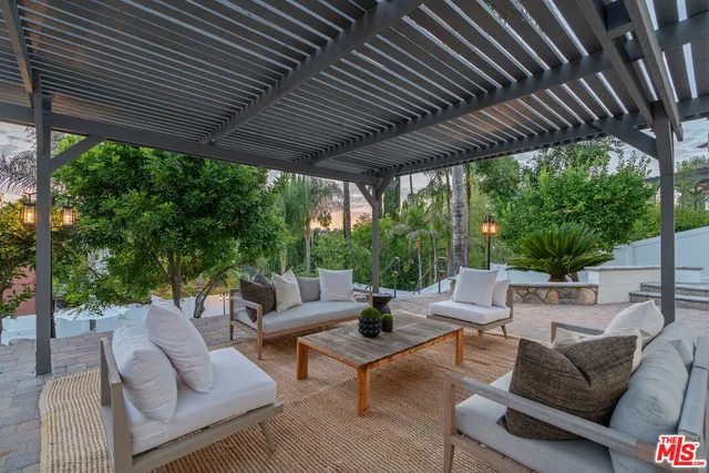 a view of a patio with chairs and a table
