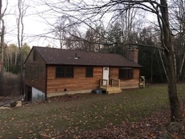 79 Searle Road Huntington, MA 01050 - Photo 3 of 14 a view of a house with backyard and trees
