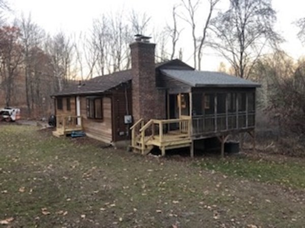 79 Searle Road Huntington, MA 01050 - Photo 4 of 14 a backyard of a house with table and chairs