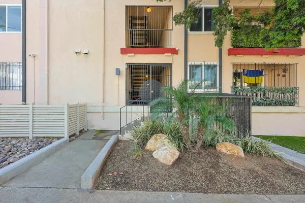 a front view of a house with garden
