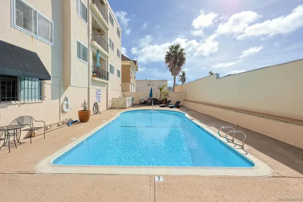 a view of a swimming pool with lounge chair