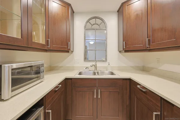 a kitchen with a sink and cabinets