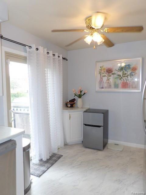 7911 Merrick Street Taylor, MI 48180 - Photo 23 of 42 23. CHARMING EATING AREA WITH CEILING FAN, CORNER BUFFET-SERVING AREA WITH CABINETS BELOW + DOORWALL TO DECK!