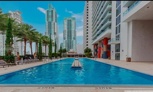 a view of swimming pool with outdoor seating