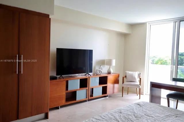 a living room with furniture and flat screen tv