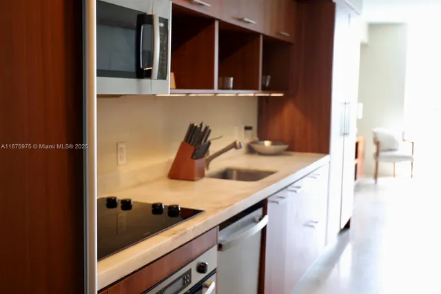 a kitchen with a sink and cabinets