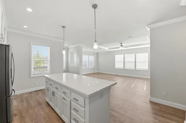 a spacious bathroom with double vanity and a bathtub