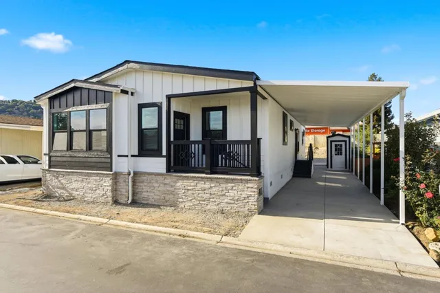 a view of a house with entrance gate