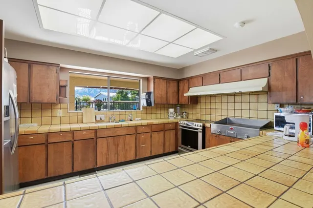 a room with furniture and pool table
