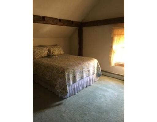271 Thompson Road Colrain, MA 01340 - Photo 11 of 16 a bedroom with a bed and a window