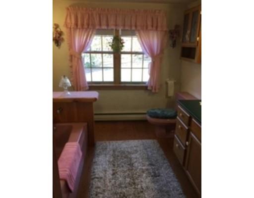 271 Thompson Road Colrain, MA 01340 - Photo 12 of 16 a room with a chair and a large window
