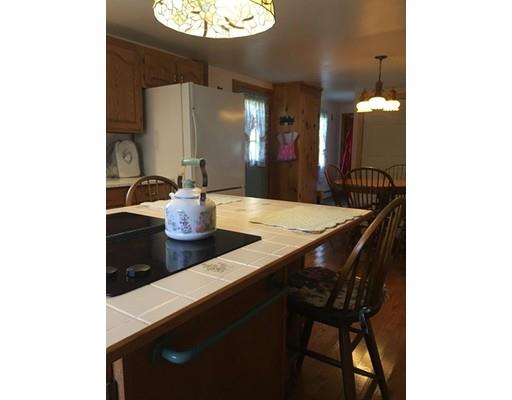 271 Thompson Road Colrain, MA 01340 - Photo 3 of 16 a dining room with a table and chairs