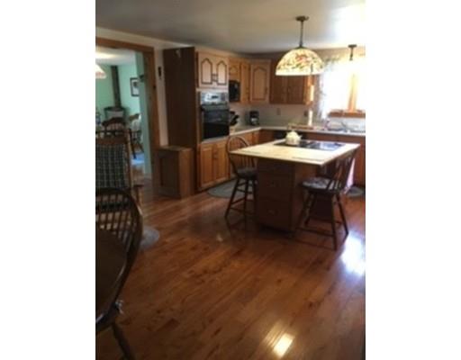 271 Thompson Road Colrain, MA 01340 - Photo 4 of 16 a dining room with table and chairs