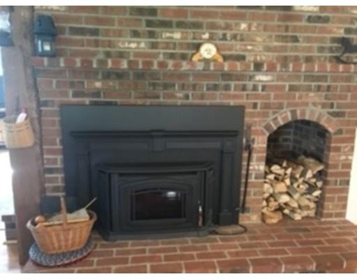 271 Thompson Road Colrain, MA 01340 - Photo 5 of 16 a closeup of a fireplace