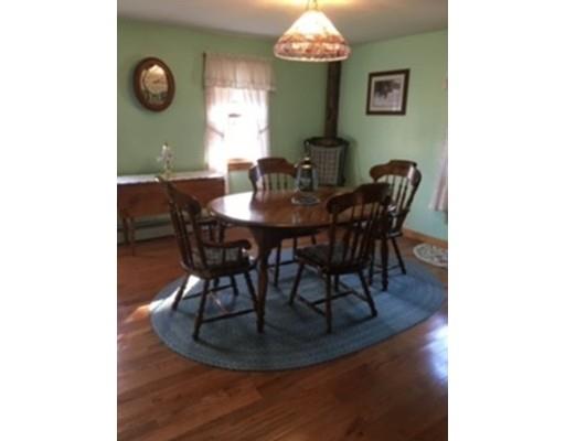 271 Thompson Road Colrain, MA 01340 - Photo 6 of 16 a view of a dining room with furniture and a chandelier