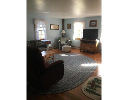 271 Thompson Road Colrain, MA 01340 - Photo 7 of 16 a living room with furniture and a flat screen tv