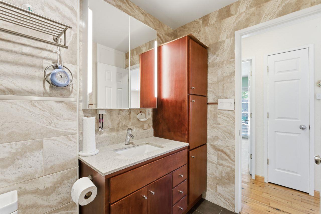 5561 Roundtree Common Fremont, CA 94538 - Photo 9 of 29 a bathroom with a sink and a mirror
